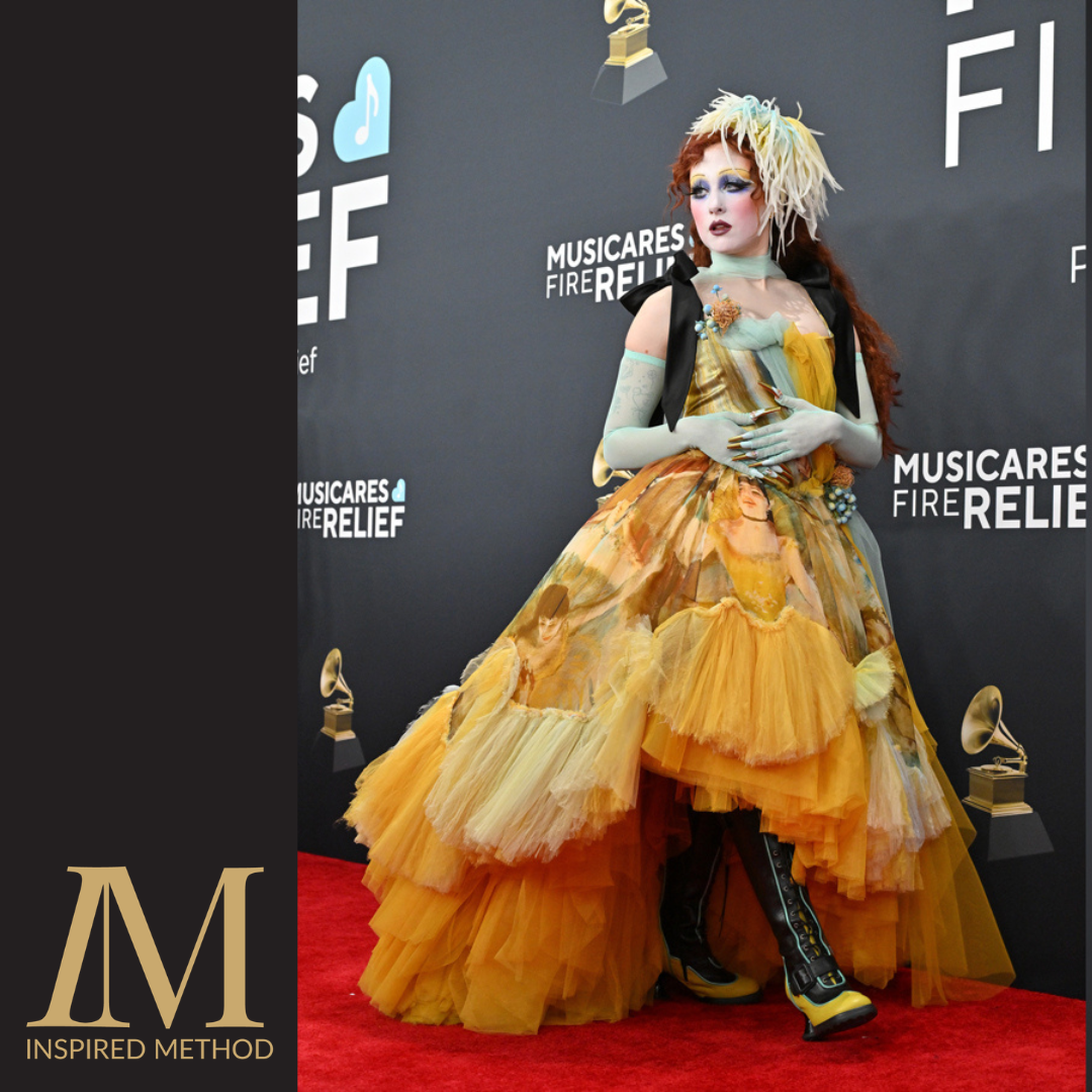 An image of Chappell Roan walking the red carpet in a yellow gown, wearing custom Fluevog Shoes